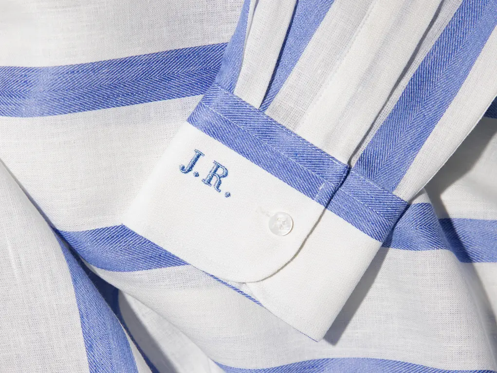 A shirt with its cuff embroidered with the letters J.R. 